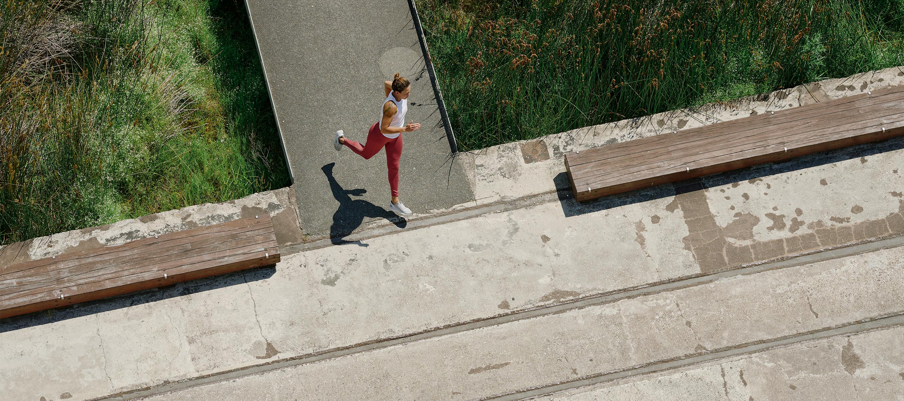 A woman running on pavement outside